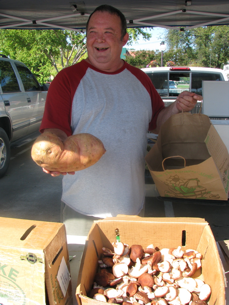 David Owens of Three Buddies, showing a five-pound sweet potato.