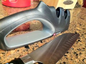 Wüsthof two-stage knife sharpener I just bought at Kreb's, and the crappy santoku it resurrected. 