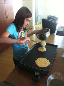Big Kid pouring the chilla, or savory pancakes